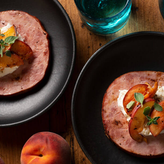 Grilled Ham Steaks with Goat Cheese and Fresh Peaches