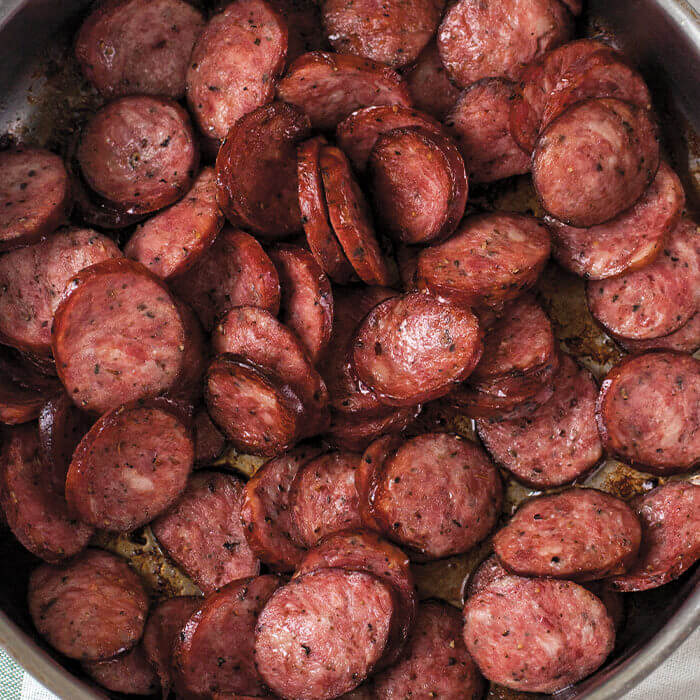 cooked kielbasa slices in a pan