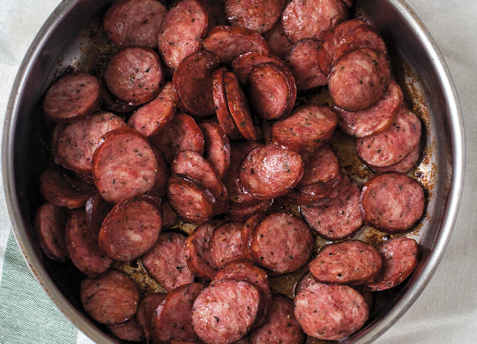 cooked kielbasa slices in a pan