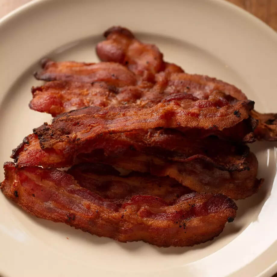 bacon on white plate