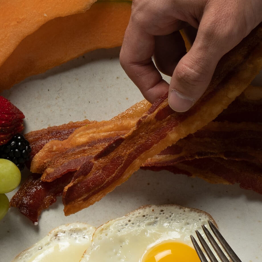 holding bacon breakfast plate